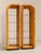 Rare pair of Henredon “Scene Two” arched display cabinets in olive burl wood, circa 1980s. Sculptural waterfall-form...