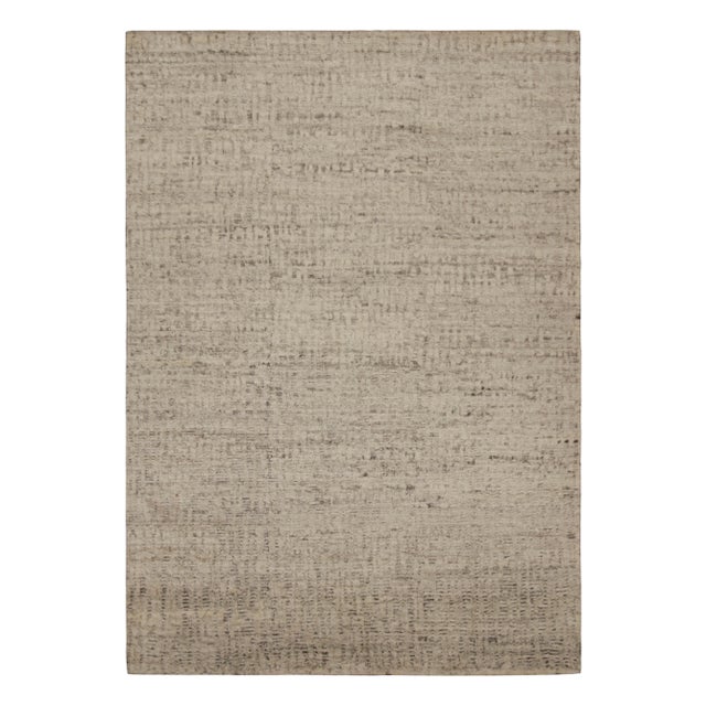 Hand-knotted in wool, this 10x14 modern textural high-pile rug in beige and brown, features a simple design, but...