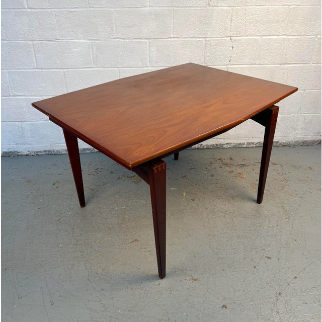 A perfect blend of craftsmanship and classic design, this Mid-Century Modern dining table is ideal for intimate spaces...