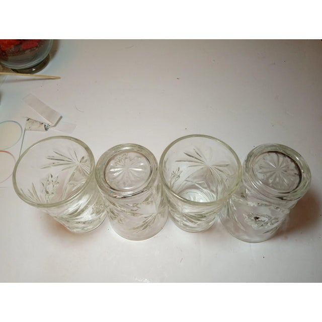 Four vintage Anchor Hocking Juice Glasses. They have the classic starbursts and star of David patterns. These were made in...