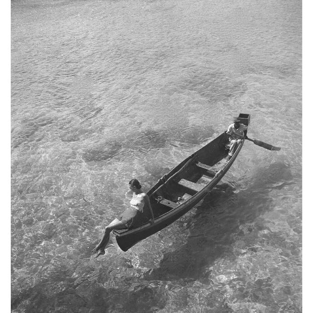 Model In Montego Bay by Toni Frissell Fashion model bein rowed across Montego Bay, Jamaica, 1946. (Photo by Toni Frissell)...