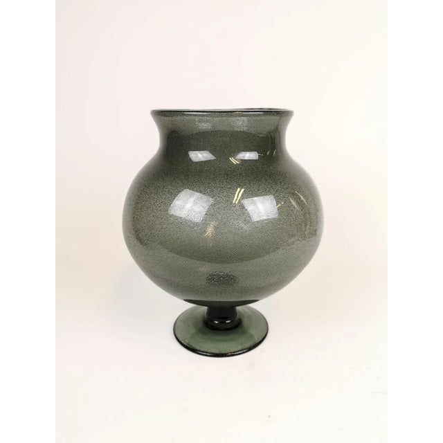 This large bowl was made at Boda and designed by Erik Höglund in Sweden, 1960s. The bottles light purple/grey/blue color...