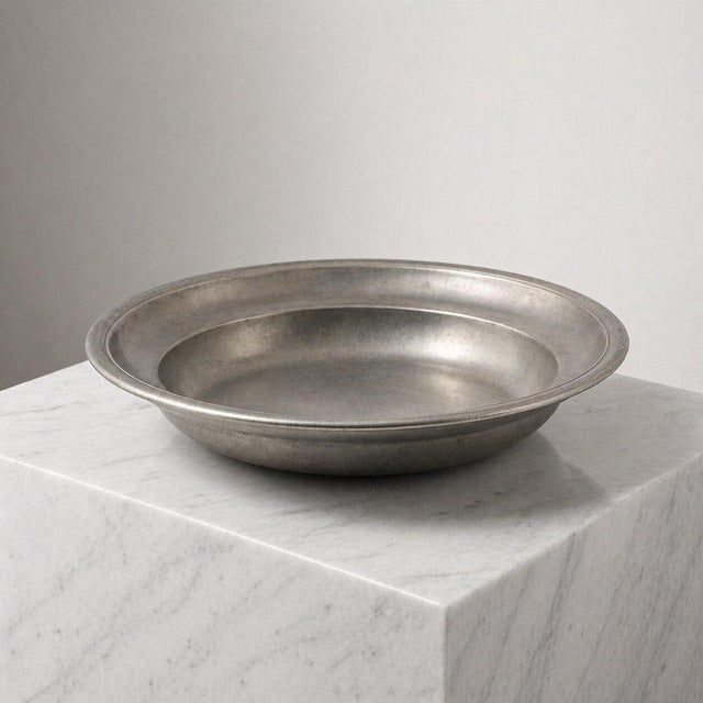Elegant Scandinavian modern pewter centerpiece bowl by Schreuder & Olsson, Sweden, 1975. This refined piece embodies the...