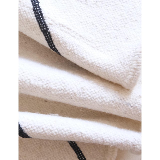 Introduce a touch of classic elegance to your home with our 2020s Moroccan Beni Ourain Kilim Rug. Measuring 9.4 x 6.4...