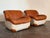 Elegant pair of vintage Italian “Swan” chairs from the 1970s, defined by their sculptural, curved silhouettes and refined...