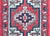 A charming petite late 20th century Persian Hamadan rug with a central geometric patterned medallion surrounded by a...