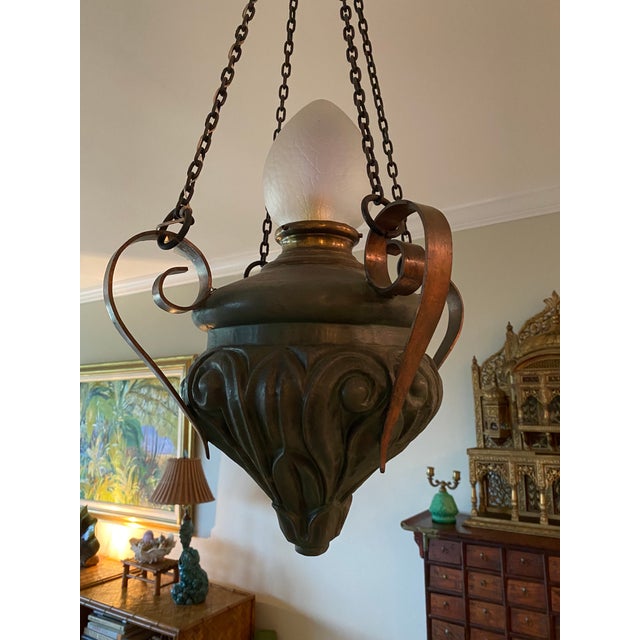 Unique and rare antique pendant light fixture. Circa 1920’s in the NeoClassic style. Patinated bronze Verdigris body with...