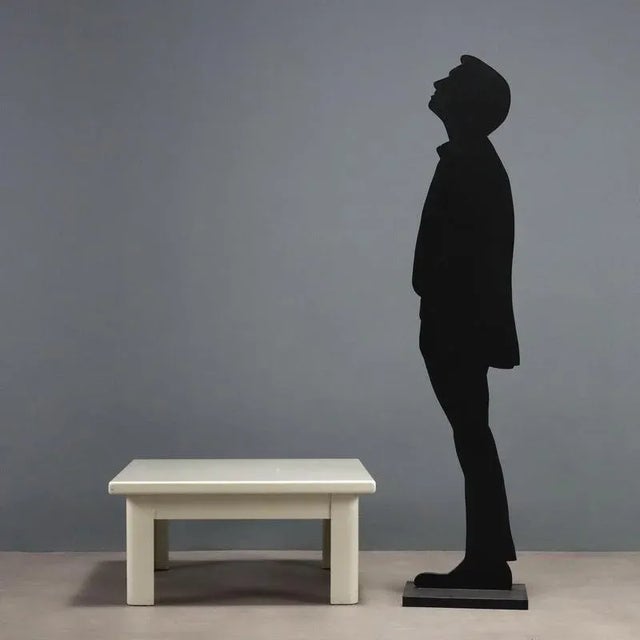 Vintage Italian-made coffee table in white lacquered wood with a square top. This piece is attributed to the mentioned...