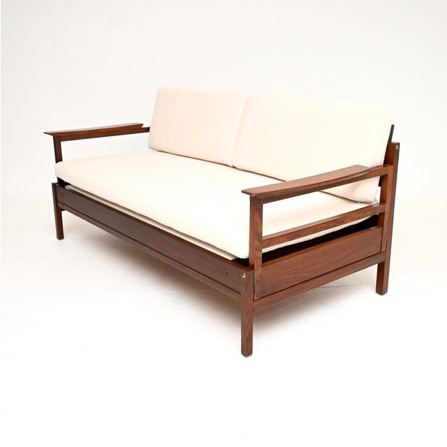 A stylish and very rare vintage Guy Rogers Gambit sofa bed. This was made in England during the 1960’s. The frame is made...