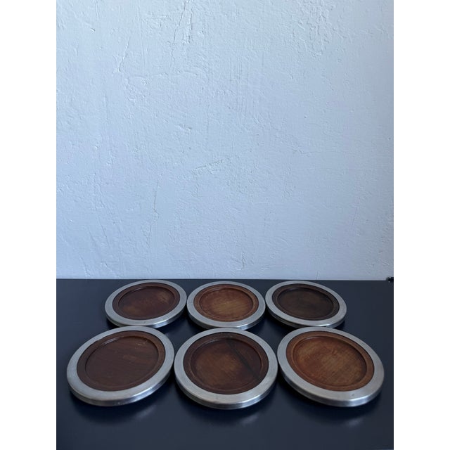 Set of 6 Jacaranda and stainless steel drink coasters designed byu Jean Dobré for Tropic-Art, Brazil 1960s.
