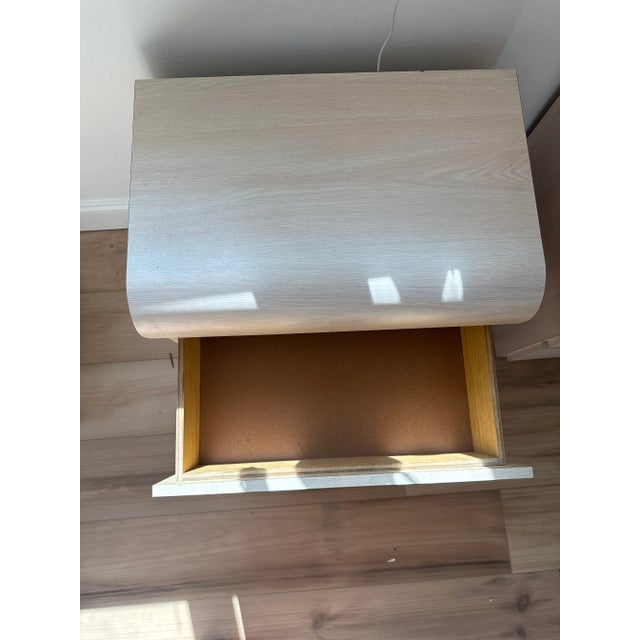 Pair of 1980's vintage Formica nightstands with a faux wood grain. Waterfall rounded front. 2 easy closing drawers.