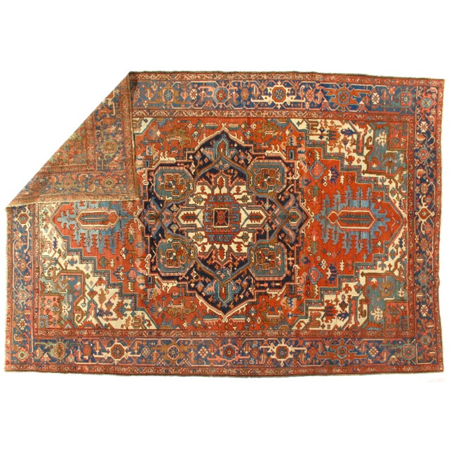 Antique Serapi rug. Hand-knotted in fine lambswool. This rug’s handmade, hand-knotted construction adds durability to this...