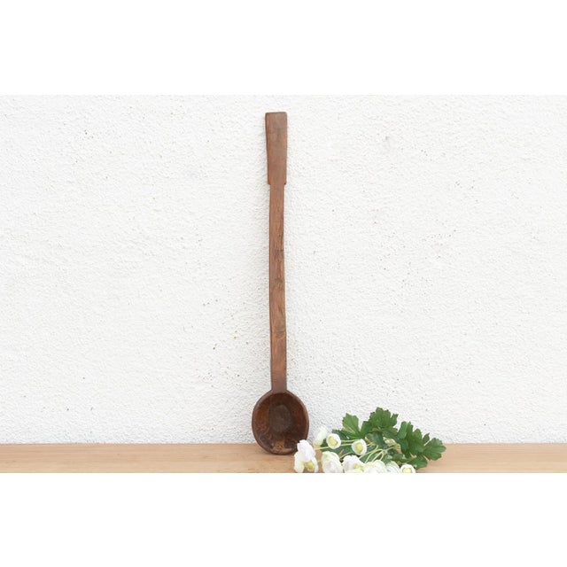 There is something deeply soulful about a simple wooden spoon—especially one carved by hand to feed a village. This...