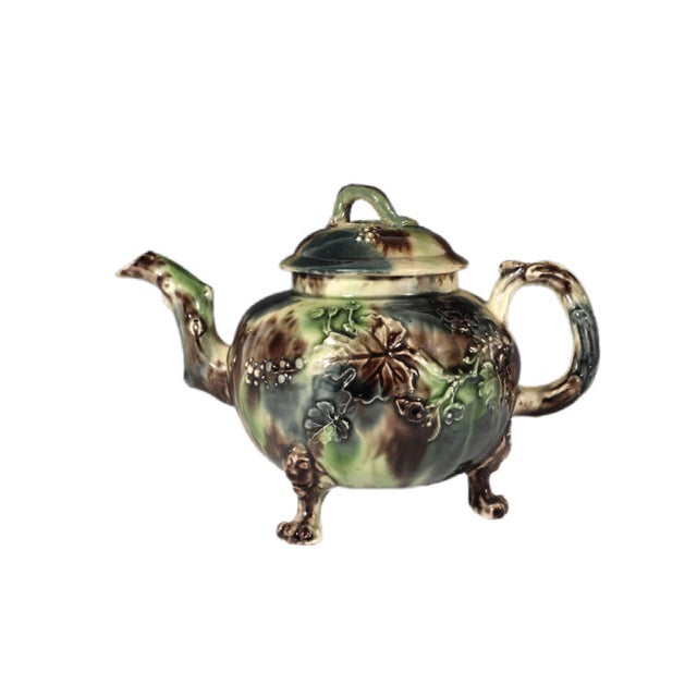 Whieldon-Type Creamware Tortoiseshell Teapot with Grape Vine Relief and Crabstock Handle, Staffordshire Circa 1765–1775...