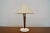 Vintage Mid-century Modern table lamp for sale. From the 1950's, and in amazing condition. It has a white metal base with...