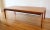 This is mid century modern Danish teak coffee table designed by Henning Kjærnulf for Vejle Stole Mobelfabrik. It has a...