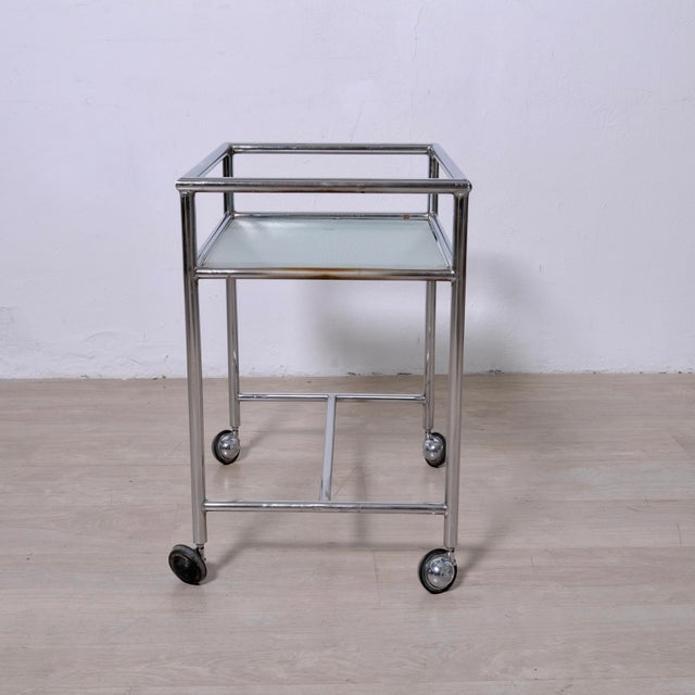 Beautiful and original vintage medical cart, made of metal and glass shelves, 1960s design. An excellent furnishing...