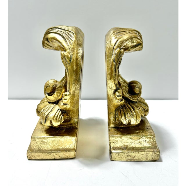 A beautiful set of Neoclassical/Rococo shell bookends. The gold leafing is stunning. They are vet detailed and eye-...