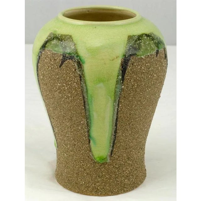 Unusual petite vase in a tradition Asian ginger jar form with the uncommon rough sand like finish. The celery colored...