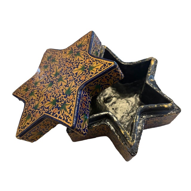 A vintage, star-shaped, lacquer box with glossy, hand-painted green, gold, and blue floral designs. Dimensions: 5"L x 5"W...