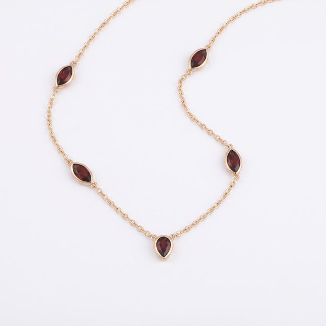 Enhance your jewelry collection with this sophisticated station necklace. Designed to offer a refined and polished...