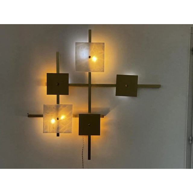 Marble and brass wall lamp in the style of Eric Dormael 1990. very good condition, almost a sculpture. Dimensions 90 x 90...