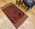 An exquisite early 20th-century Baluch tribal area rug, crafted with exceptional detail and artistry. This antique rug...