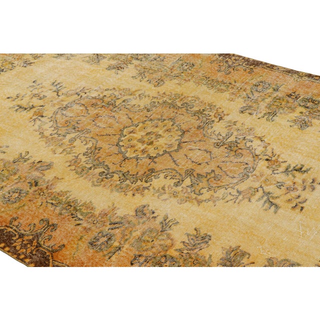 Hand-knotted in wool, this 5x8 vintage Turkish rug is from that collection of mid-century rugs with antique washes giving...