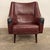 Mid-Century Modern Ib Kofod-Larsen brown leather lounge chair with stunning rosewood legs.