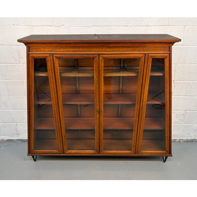 Make a statement with this striking mid-century modern display cabinet by Young Manufacturing Company, a beautifully...