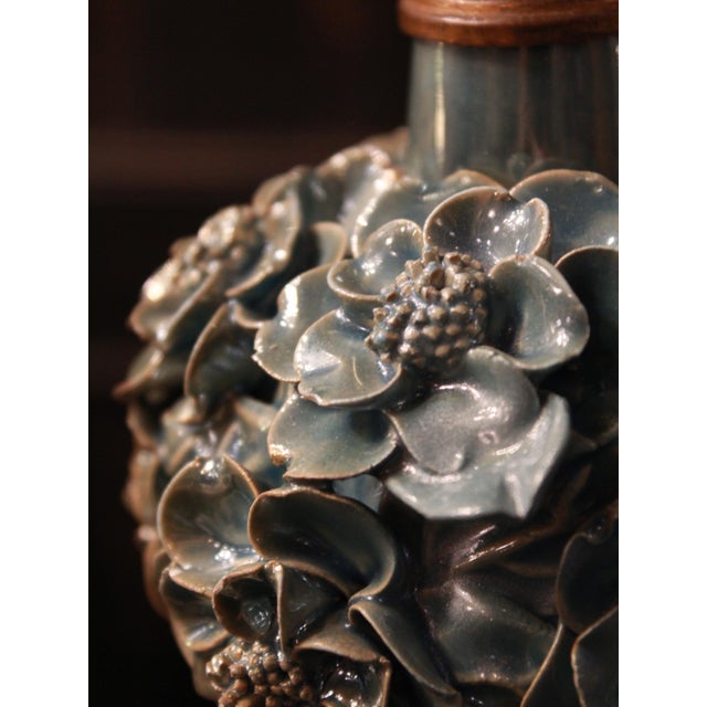 Elegant lamps from Manises, with an iridescent light blue color and a floral design, revealing new nuances with every...