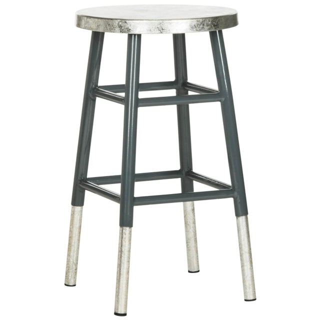 A bold illustration of modern luxury, this decadent silver-dipped counter stool was inspired by classic pieces in Paris’...