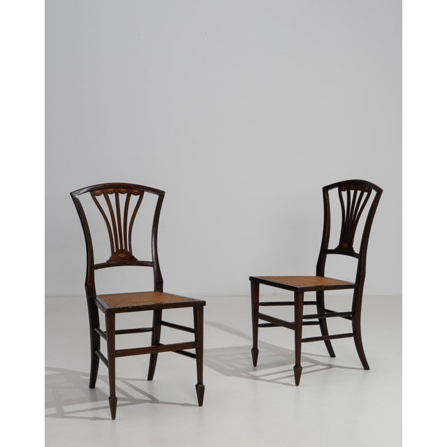 Exemplifying the refined restraint of the Georgian aesthetic, this distinguished pair of accent chairs from 19th-century...