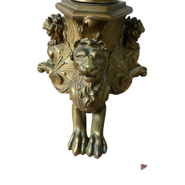 A heavy bronze antique carved red marble piece in a French dore neoclassical design typically showcases elaborate...