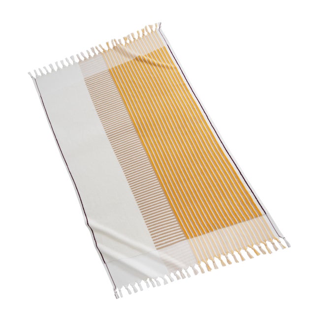 A fresh take on classic geometric motifs, our Nomade collection elevates any beach day with its warm color palette and...