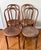 Set of four iconic cafe bistro dining chairs, made in Poland by the Mazowia factory, in the style of Thonet. These period...