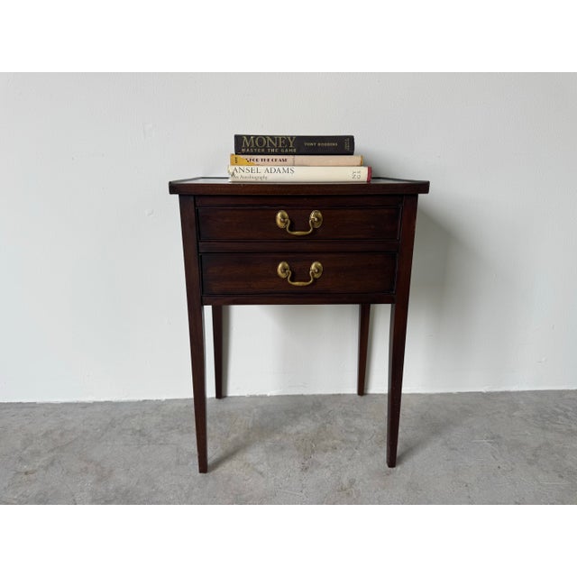 Beautiful vintage Henkel Harris small nightstand featuring a classic, timeless design and exceptional craftsmanship. This...