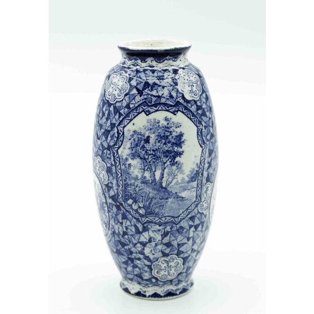 Porcelain Blue Vase with decorations is an object from the late 19th century by Franz Anton Mehlem. Excellent condition...