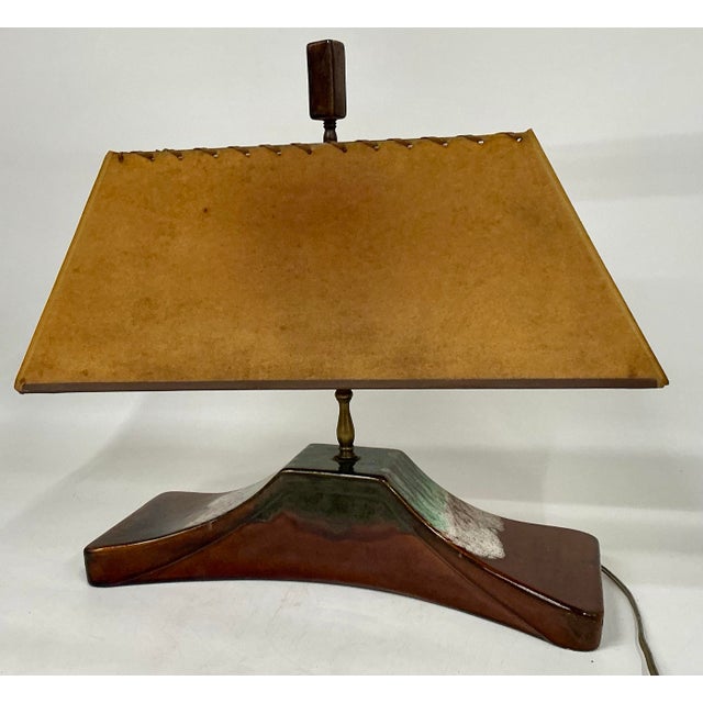 Unusual horizontal shape glazed ceramic vintage table lamp. Original shade and ceramic finial.