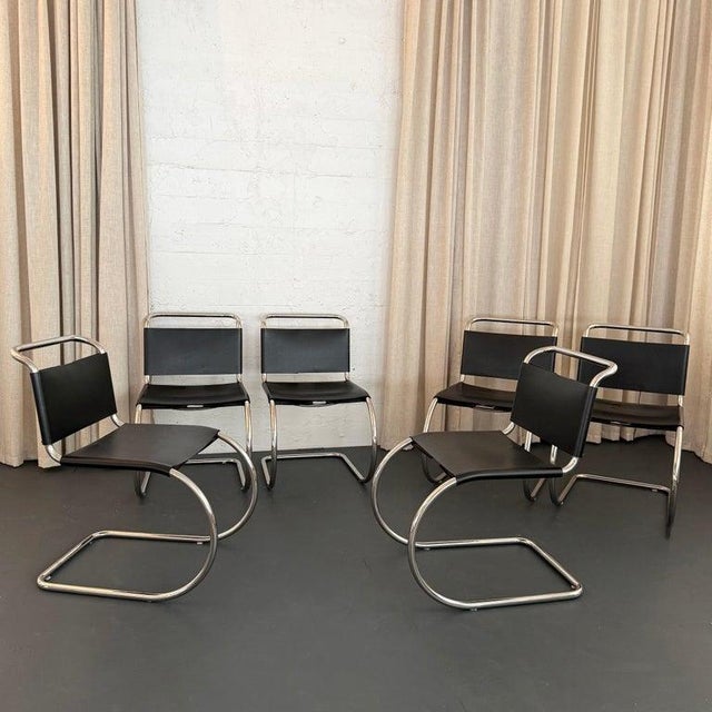 This is a set of 8 cantilever dining chairs by Ludwig Mies van der Rohe produced for Knoll circa the 1970s. An icon of...