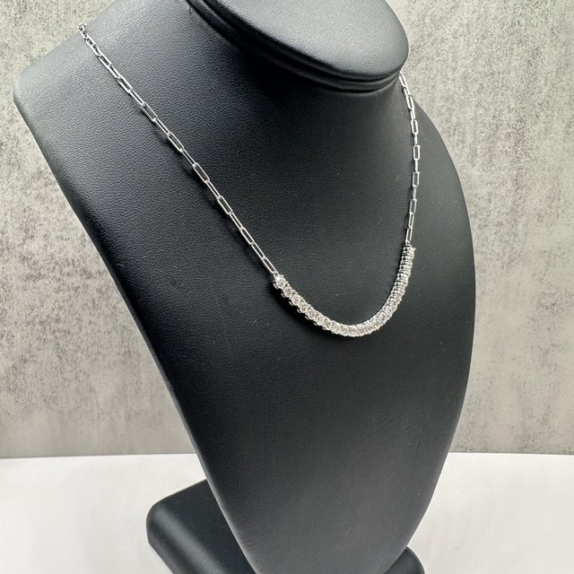 This stunning diamond tennis–style link necklace in 14kt white gold features 3 carats total weight of natural GH SI2–I1...