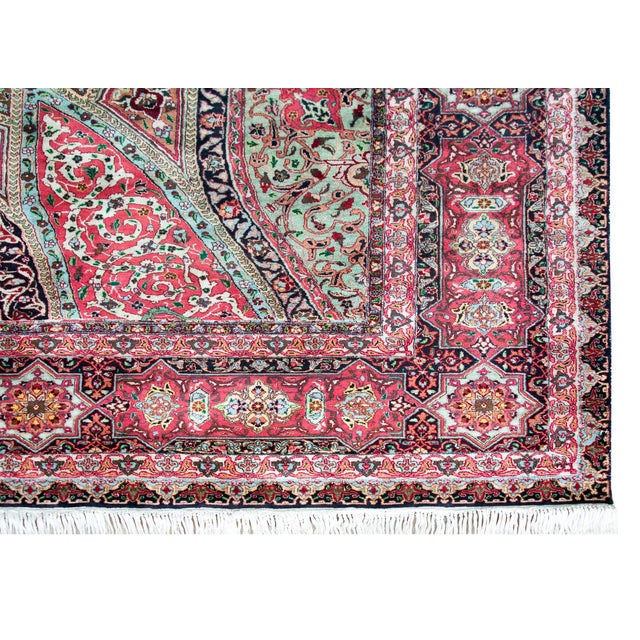 A remarkable 100% hand-knotted silk vintage Persian Qum rug with a mesmerising medallion with myriad flowers and scrolling...