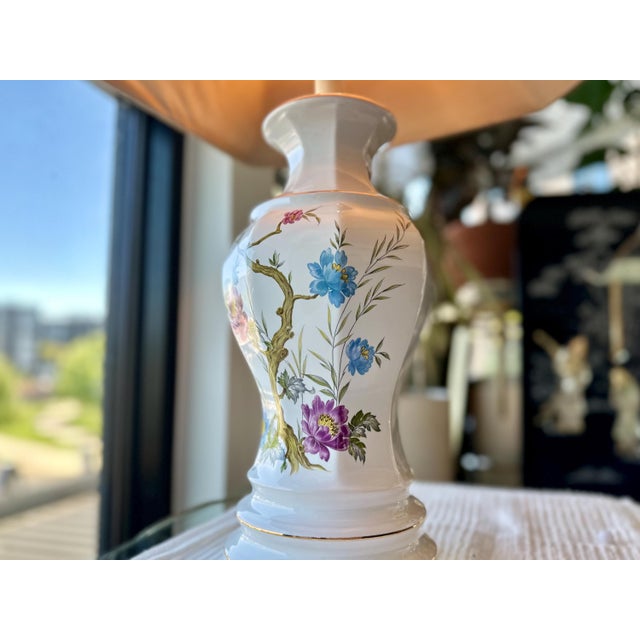 From Royal Haeger’s 1960 catalogue, the M‑501 porcelain lamp pairs an American baluster form with climbing florals and...