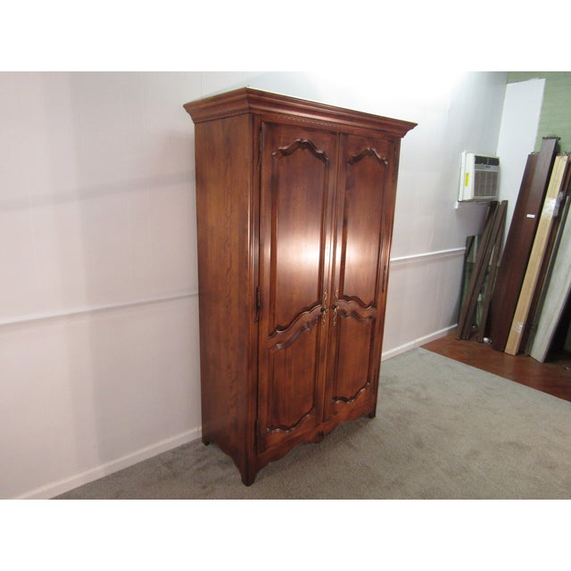 Item: 86677 Ethan Allen solid maple French Country linen cabinet. Age: 1990's. Details: Dovetailed drawers. Condition:...