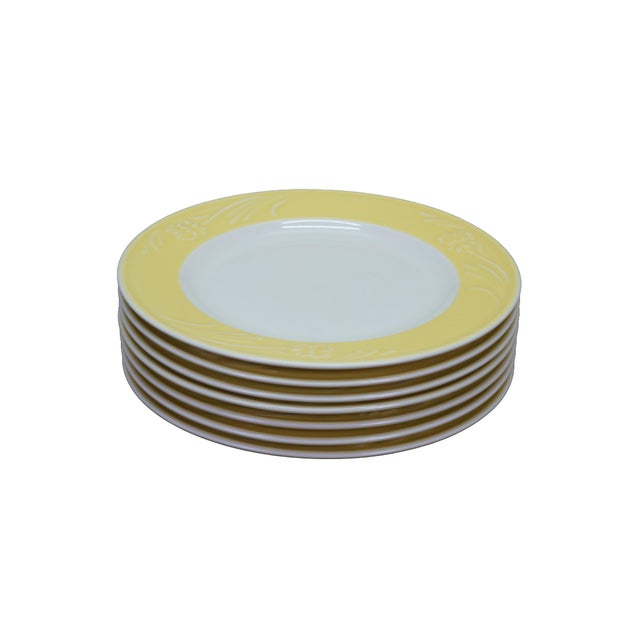 Set of seven vintage Lenox porcelain dinner plates in the Yellow Poppies Rainbow pattern. Each plate features a decorative...