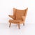 Ap19 papa bear chair designed by hans j. Wegner and manufactured by ap stolen. The lounge chair is upholstered in cognac-...