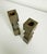 A pair of 1950s oak wood candlesticks with a muted olive green painted finish. The stick center features a zigzag cut,...