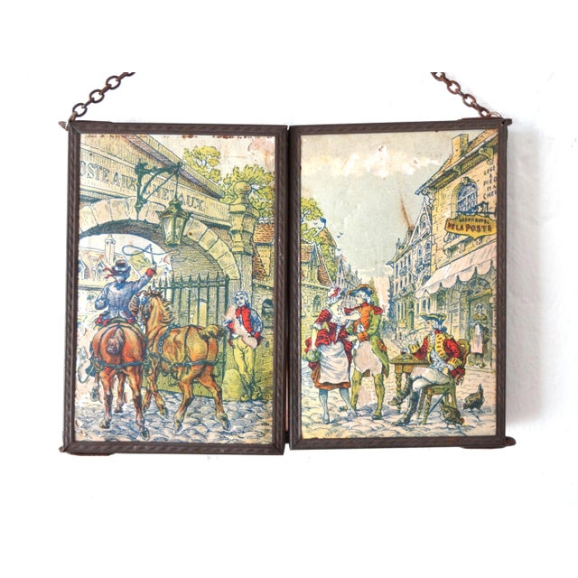 An antique French shaving or vanity mirror, folding triptych style with three mirrors. Covered in a paper scene of 18th...