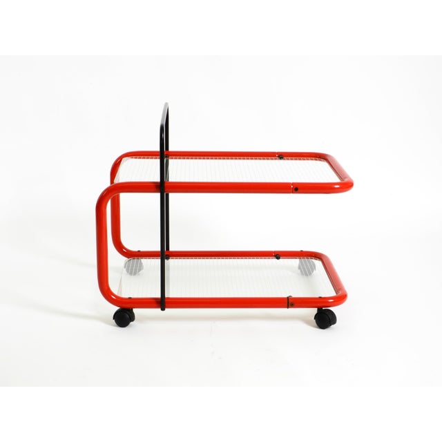 Beautiful 1980s Post-Modern serving or bar cart made of metal and glass. Made in Italy. Typical 1980s Italian design. Also...