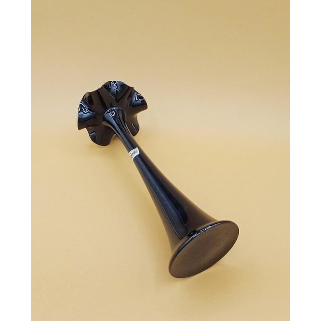 Anetta brand black glass vase with wavy edge. Retains its original sticker. This piece has an attribution mark, I am sure...